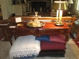Amcerican Drew sofa table, silverplate tray with decanter, large pillows underneath table