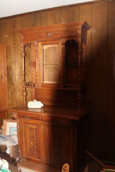 fabulous old english hutch with the king and queen and jester carved into it!