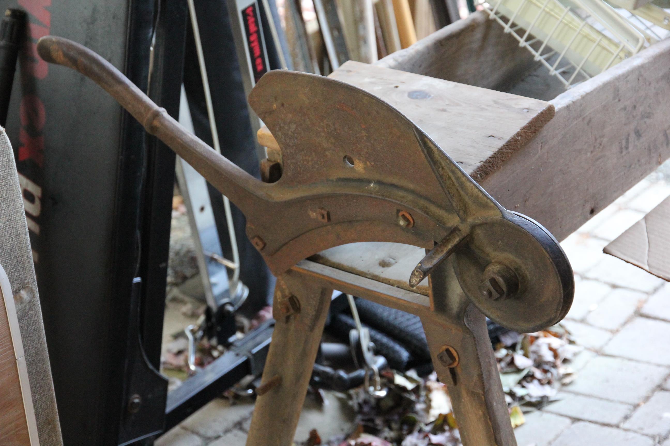 Antique straw cutter (chaff cutter), one of several antique farm implements in the sale.