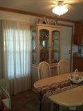table and 6 chairs and china hutch