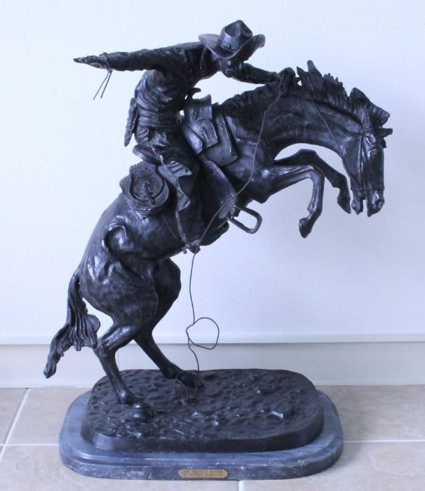 Giant solid bronze statue of Remington's "Bronco Buster" signed "Frederic Remington", on marble base: 32" high. Item cannot be shipped: winning bidder must pick up this item in person at our San Antonio, Texas gallery.