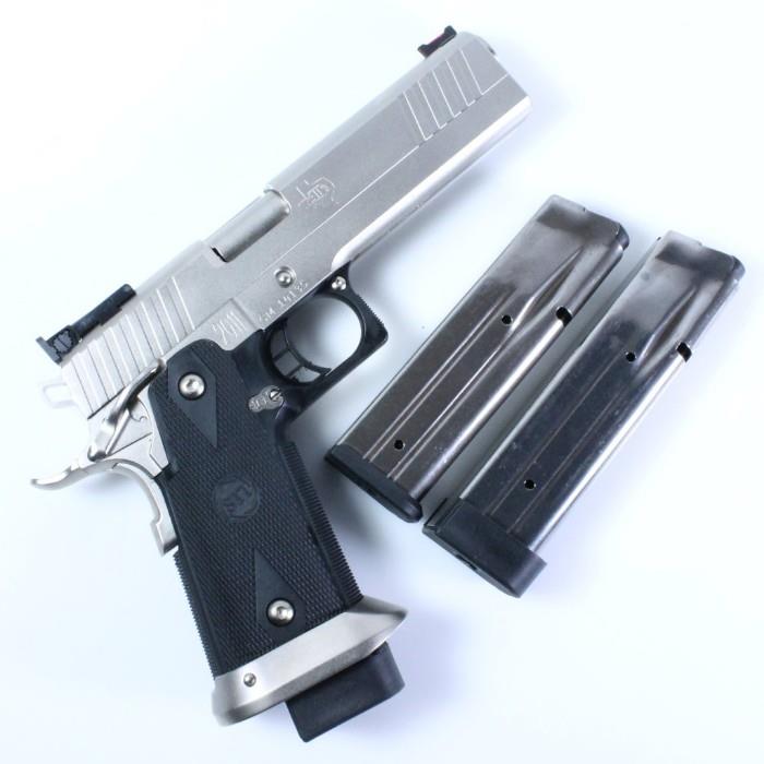 Like-new STI EDGE 2011 chrome-plated semi-automatic pistol, .40 S&W cal, with 3 magazines [145mm (2) & 130mm (1)], fiber optic front sight, plastic grips, 5 extra springs, manual & hard carrying case: 5” barrel, 8 1/2” overall length, serial #CM14XXX. Action works well; very smooth! In accordance with U.S. law, this lot must either be picked up at our San Antonio, Texas gallery or shipped to a U.S. licensed firearms dealer (FFL) of the buyer's designation. Handguns will be shipped via USPS Priority Mail; shotguns & rifles will be shipped via UPS Ground. By bidding on this lot, you agree not to fire this gun before it is examined by a gunsmith. Know your local & state gun laws before you bid.
