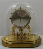 Vintage Kundo 400 Day Anniversary Clock from West Germany. Glass dome appears to be original. Clock wound up and appeared to be keeping time. Marked Kundo, Kieninger & Obergfell, Made in West Germany. Clock appears to be in Good Condition. Measures 9.5"w. x 9.25"h. 