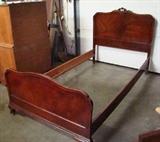 Mahogany Drexel Bed Frame from The Newport Collection. Features carved headboard and boarders. Measures 77"l. x 43"h. x 41"w