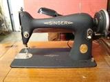 Vintage Singer Sewing Machine with Table and Bench. Sewing machine powers on and appears to be in working order. Measures 21"w. x 31"h. x 17"d. 