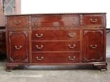 Mahogany Buffett with Padded Flatware Drawers, Five Pull Out Drawers, and Two Cabinet Doors. Piece was originally purchased from North Carolina in the Mid-Century. Matches pieces from lots 1 & 2. Features original hardware, carved edges and columns, and veneer scrolled trim. Measures 64"w. x 36"h. x 18"d.