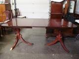 Mahogany Drexel Expanding Dining Room Table from The Newport Collection with Four Matching Side Chairs. Table includes one leaf along with a full pad and pad cover with faux wood pattern.