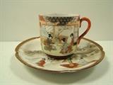 Matching Porcelain Cup and Saucer. Both have unknown markings. Cup measures 2.75"h. and saucer 5.75"w. 