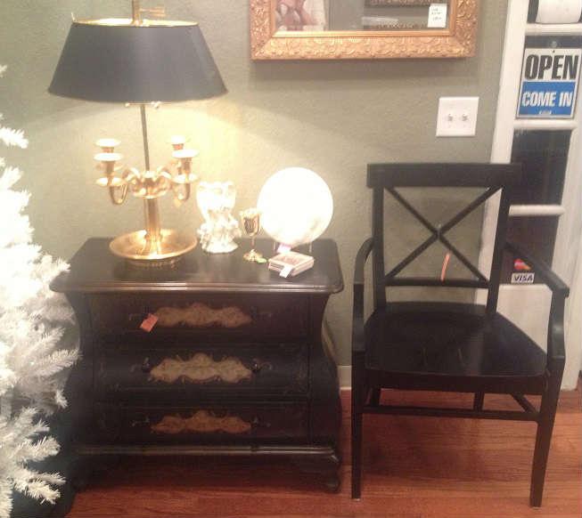 Black Bombay chest with gold accents, black Crate & Barrel chair, gorgeous lamp