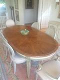 10 ft long dining room table w/3 leaves & 8 chairs