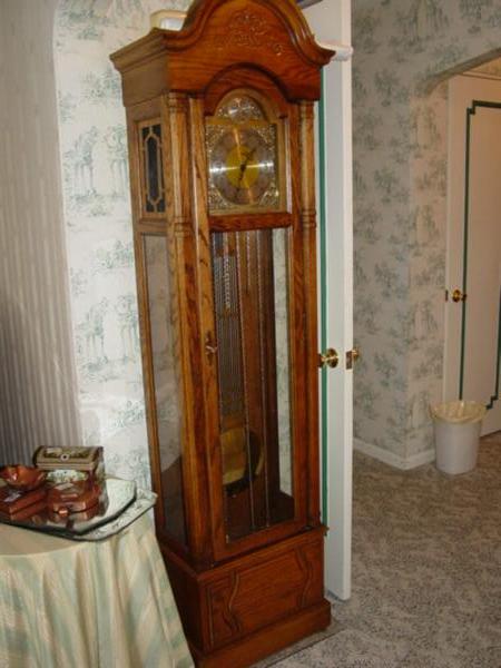 Howard Miller oak case Grandfather Clock.