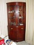 Drexel Mahogany bow-front china cabinet (one of two available).