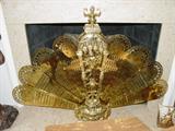 Solid brass elaborate fan-shaped fireplace screen.