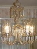 Beautiful crystal chandelier with lights on.