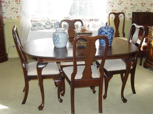 Ethan Allen cherry Queen Ann style dining room table plus six chairs.  This is part of the 9-piece dining room suite.
