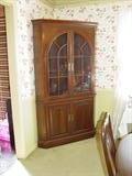 Ethan Allen cherry corner china cabinet part of the 9-piece dining room suite.