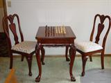 Game table with two chairs.
