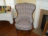 Mahogany wing channel back armchair mauve/blue design fabric.