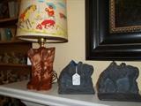 Antique Heavy Iron Door Stops and a wonderful ceramic aged cowboy boot lamp with early mid-century shade