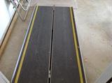 Folding wheelchair access ramp.