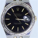 Authentic estate Rolex Oyster Perpetual Datejust 2-tone 18K yellow gold & stainless steel wristwatch with a ~1.50 ctw baguette diamond aftermarket bezel (SI2 to I1 clarity, H to I color): 1 3/8” case, 8” bracelet, Swiss quartz movement, style #17013, serial #E941XXX. Watch is running. Some signs of use on inside & outside of bracelet & watch case.