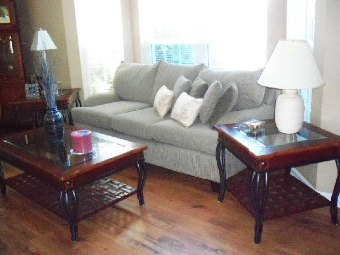 matching couch with 3 pc wood/metal/leather coffee table and matching end tables. 