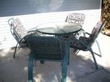 4 pc glass/metal patio set with cushions