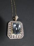 14K AQUAMARINE & DIAMOND PENDANT, MARKED 14K, WITH 18" 14KT CHAIN, TRADEMARK RT, WITH CUSHION MIXED CUT NATURAL AQUAMARINE, 9.20CT, WITH 150 ROUND BRILLIANT CUT DIAMONDS, .94CT, CLARITY SI-1 TO I-1, COLOR F-H; TOTAL WEIGHT OF COLORED STONES 9.20CT, TOTAL WEIGHT OF DIAMONDS .94CT, TOTAL WEIGHT OF PENDANT/CHAIN 11.80 GRAMS, WITH CERTIFICATE OF APPRAISAL WITH ESTIMATED RETAIL VALUE OF $12850.00