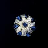 black and gold brooch