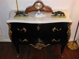 Fine Black Lacquer Louis XV-Style Chest w/ Ormolu Mounts and a White Marble Top; with a pair of Art Deco Panthers; a Deco Chiming "Greyhound" Clock; and a Meissen Lidded Dish.
