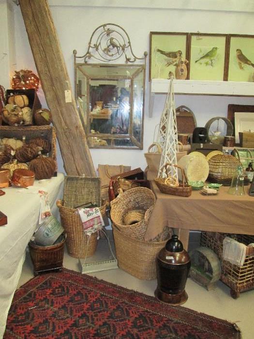 Reclaimed wood beam, unique mirror, baskets, tons of French style decor