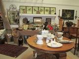 Round oak table, Pottery Barn bowls, great Bird lithos, etc