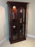 ~ LIGHTED, GLASS SHELVED CURIO, CHINA CABINET. TWO SHELVES HAVE PLATE-HOLDING GROOVE. ~