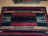 ~ 100% WOOL RUG 42" X 67" plus fringe.
