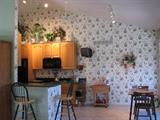 Cozy Kitchen Bar Area, Perfect for that Morning Coffee or Tea.  Bar Stools, and Decorative Items