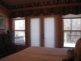 Oversized Master Bedroom with French Doors Opening to the Deck and Overlooking the Woods and Pond... Spectacular View!