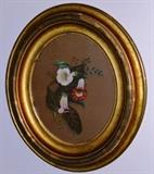 Early botanicals in gilded frames.