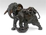Lot 1027:  MEIJI PERIOD JAPANESE BRONZE ELEPHANT & ATTACKING TIGERS SIGNED: A finely detailed and emotive sculpture depicting a large and muscular elephant's plight being under relentless attack by two aggressive tigers for predation. Meiji period marking on underbelly of the elephant. 19''h. x 27 1/2'' x 13 1/2'' w. Est. $3000/5000**
CONDITION: Unexplained flaw to tusk.