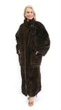 Lot 1309:  FULL LENGTH SHEARED RABBIT FUR COAT: Tones of dark brown, large patch pockets, button front and collar. Wearable with or without the belt. Measures approx. 55'' collar to hem 221'' shoulder to shoulder and 18'' shoulder to cuff.
CONDITION: Tear brlow the collar, near the right shoulder .