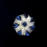 black and gold brooch