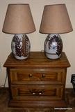 one of two matching nightstands and two matching pottery lamps