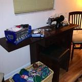 Retro sewing cabinet and working singer sewing machine with bench from 1950's