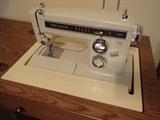 Kenmore Sewing machine includes cabinet