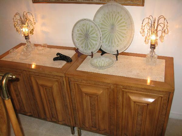 On the buffet are 3 matching pieces of Higgins glass in perfect condition.