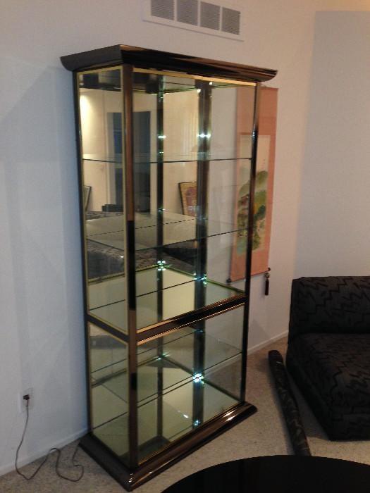 Lot #1  
 5 shelf chrome and gold toned trim glass display case measures 79 1/2" tall 39" wide 18" deep at base
