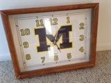 Lot #3 
University of michigan clock 14" x 11 1/2" wood frame uses AA battery