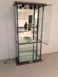 Lot #1 
5 shelf chrome and gold toned trim glass display case measures 79 1/2" tall 39" wide 18" deep at base
