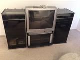 Lot #33 
Entertainment center with 32" Toshiba TV remotes included. 
