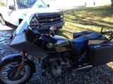 1980s BMW motorcycle with luggage racks and quicksilver windshield