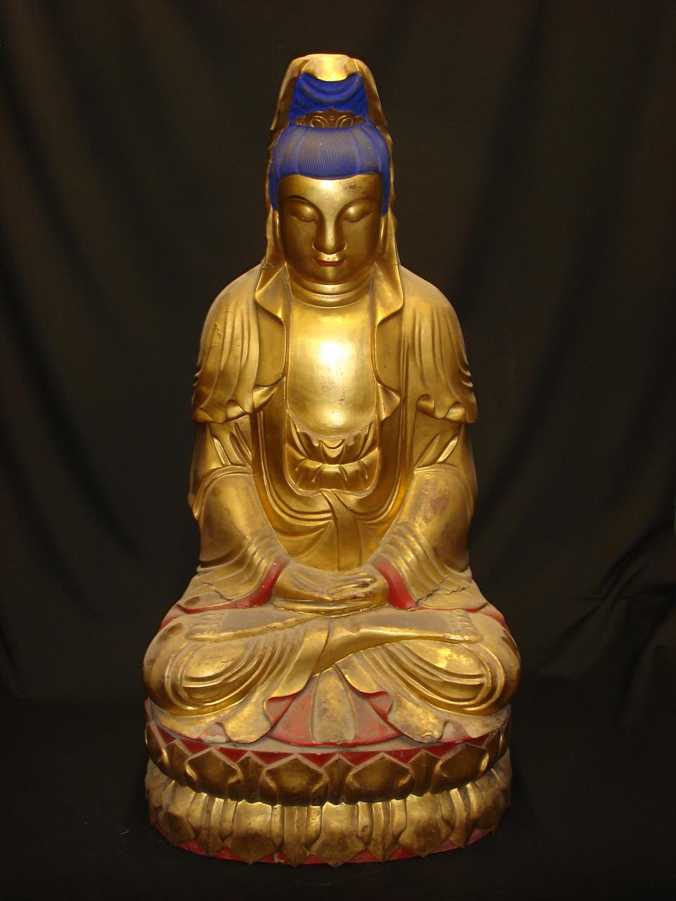 Carved wooden, gilded, seated Buddha.